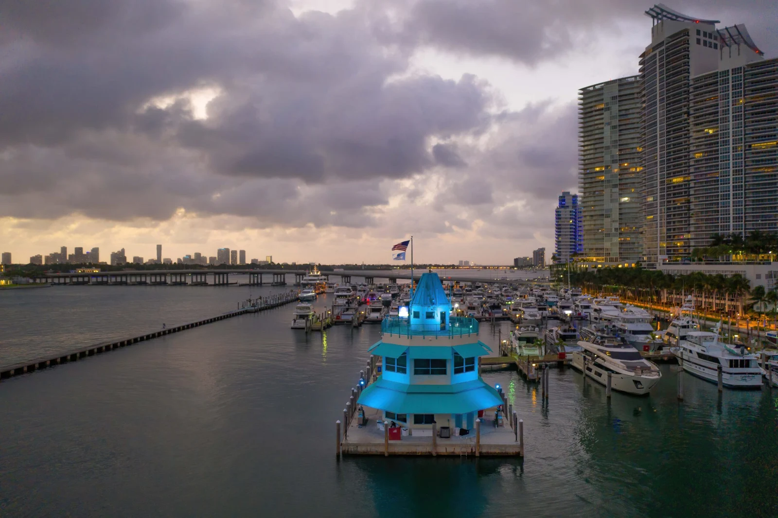 Miami Beach Marina at dusk with illuminated waterfront structures